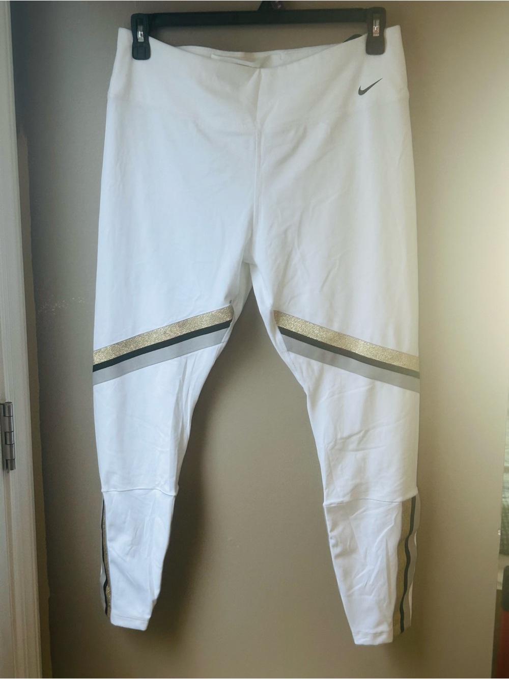 NWT Nike One Tight Fit Women’s Leggings with Gold, Gray, and Black Stripes.